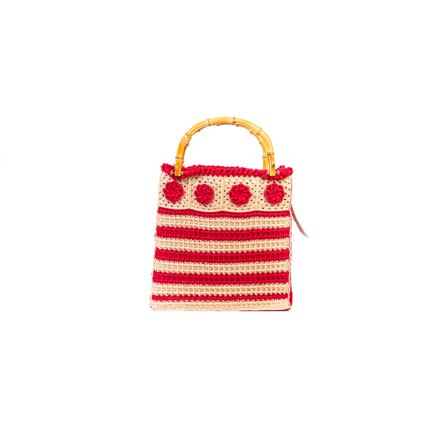 Dal basso verso l’alto, questa Tote Bag, presenta delle linee ordinate composte dal "punto waffle". I manici in bambù, uno dei simboli identificativi del brand, permettono di indossarla come borsa a mano. Di manifattura artigianale, prodotta in Italia.